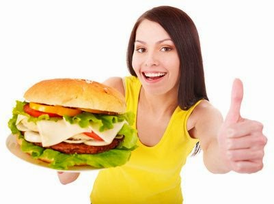 Woman holding hamburger. Isolated.